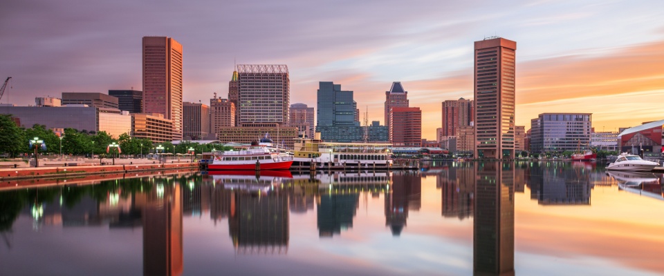 Baltimore Inner Harbor skyline at dawn, highlighting one of the top cities to watch for waterfront living and urban revitalization.