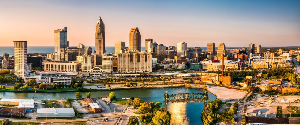 Panoramic sunset view of the Cleveland, Ohio skyline, highlighting one of the top cities to watch for growing urban living and waterfront views.