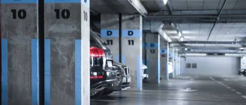 View of cars in an underground parking to illustrate tandem parking.
