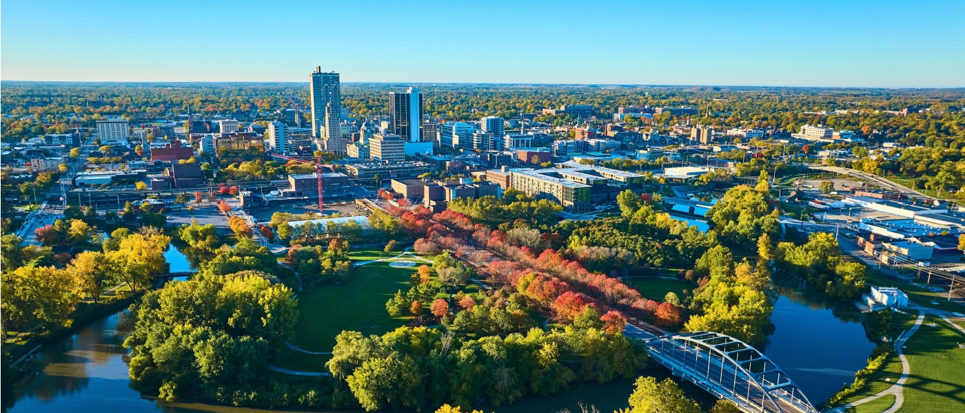 Aerial view of cityscape, bridge and river in Fort Wayne, IN, to illustrate the cost of living in Fort Wayne, IN.