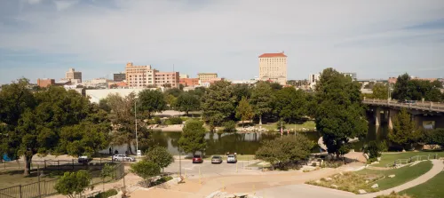 Downtown Lubbock, Texas skyline with city park and surrounding buildings, representing affordable neighborhoods with accessible urban living.