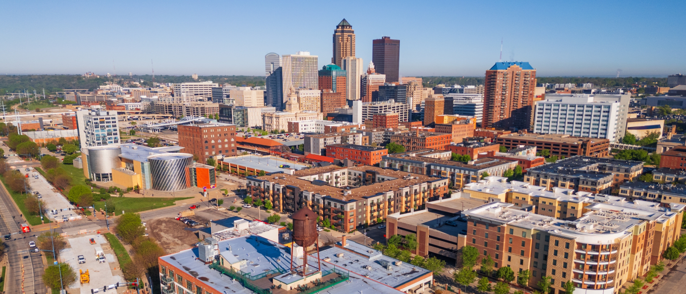 Aerial view of downtown Des Moines, Iowa, highlighting the city skyline and surrounding areas featured among the best affordable neighborhoods for renters.