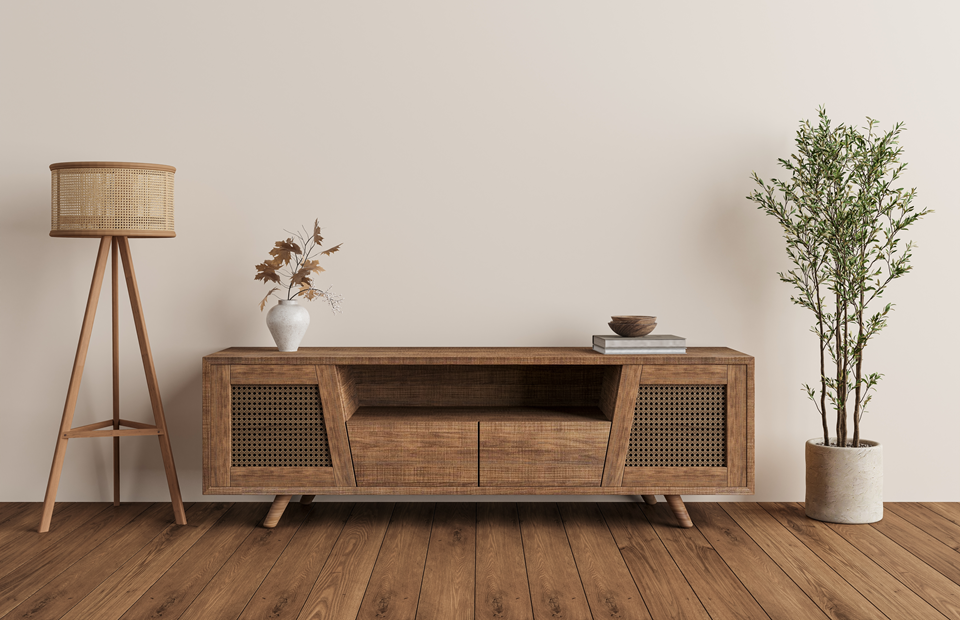 rustic looking lamp next to wooden console and plant