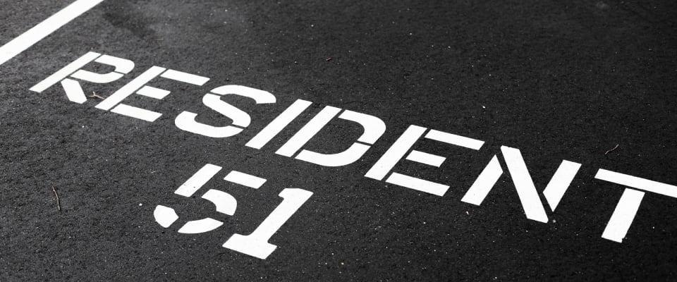 An assigned parking space labeled "resident 51".