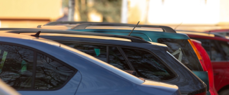 A row of cars in an assigned parking lot.