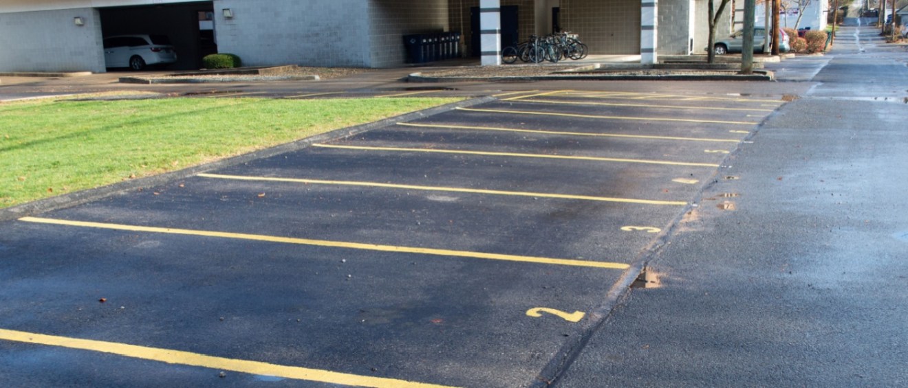 A picture of assigned parking spaces in an apartment community parking lot.