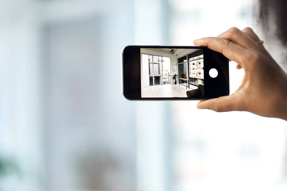 person recording rental apartment condition before moving in