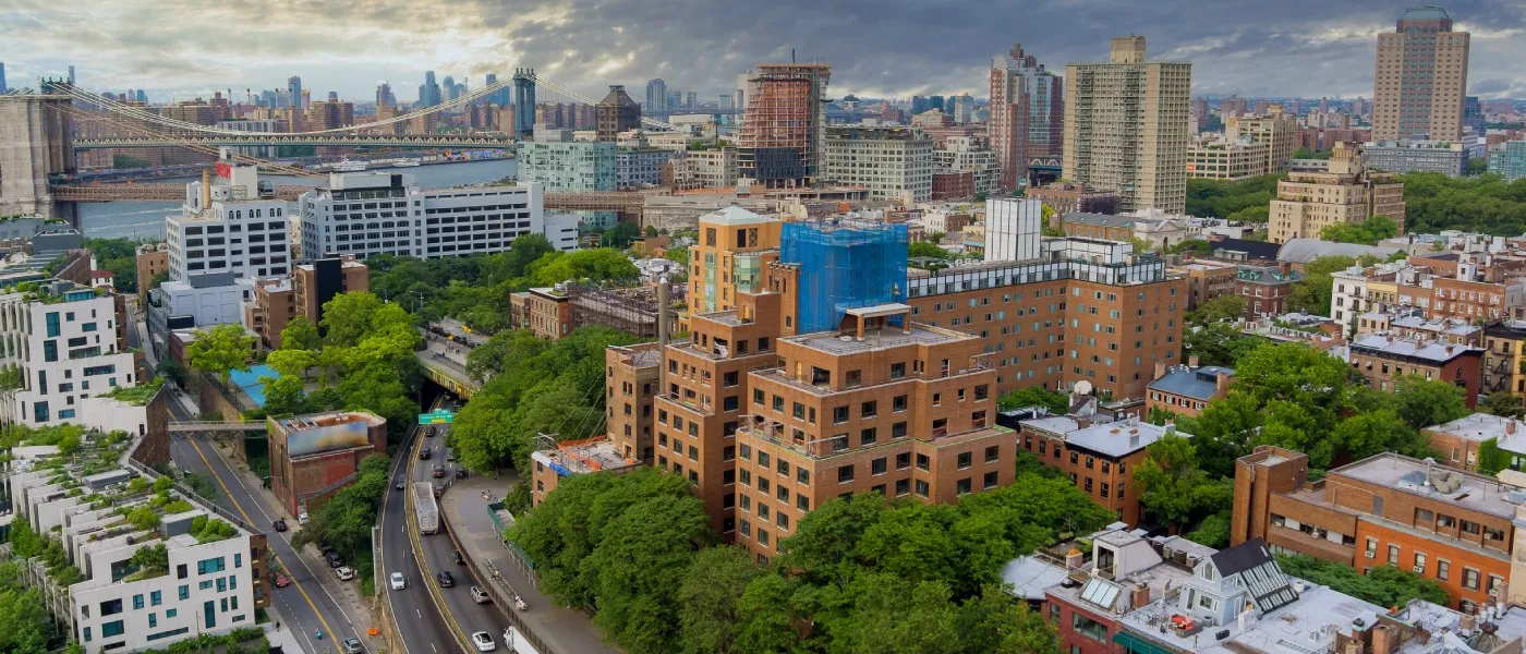 An aerial view of Brooklyn and Brooklyn Bridge to illustrate questions to ask before renting an apartment in Brooklyn, NY.
