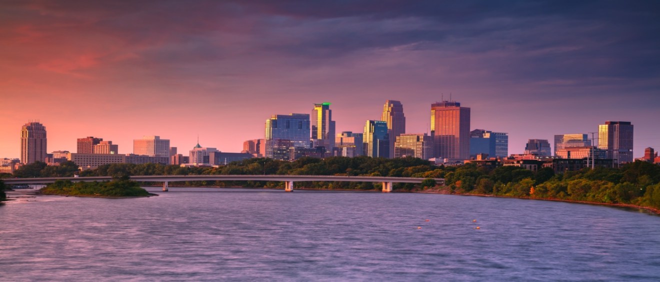 Panoramic autumn sunrise over downtown Minneapolis, Minnesota, representing urban housing trends and insights for a renter engagement tracker.