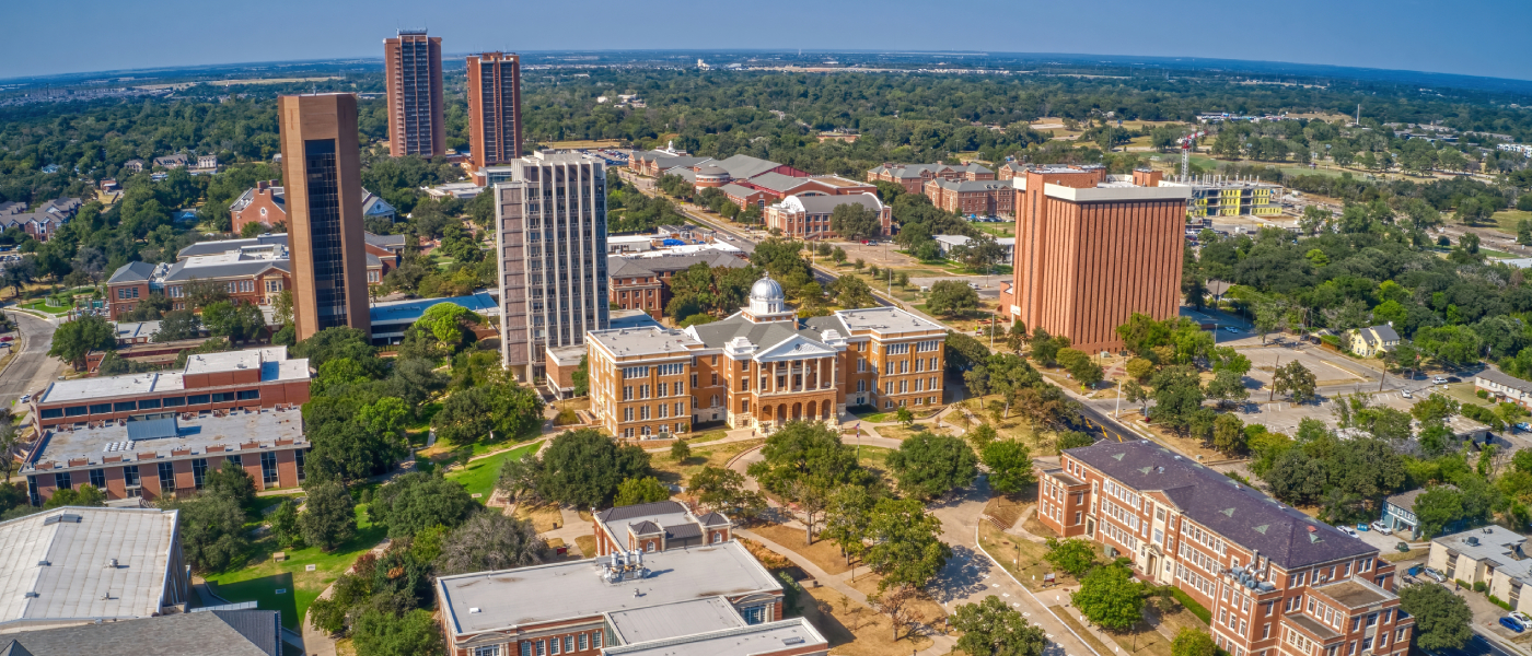 An aerial photo of Denton, TX, a city where renters can find affordable neighborhoods to rent an apartment in.