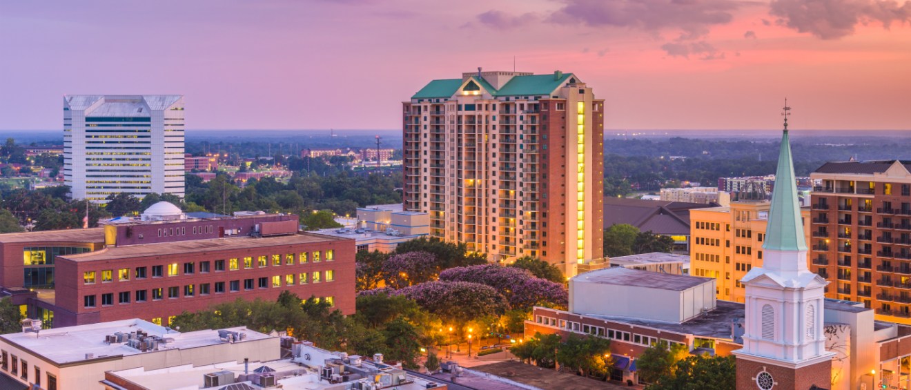 A dusk-time photo of Tallahassee, FL, a city where renters can find affordable neighborhoods with rent prices below the city average.