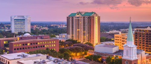 A dusk-time photo of Tallahassee, FL, a city where renters can find affordable neighborhoods with rent prices below the city average.