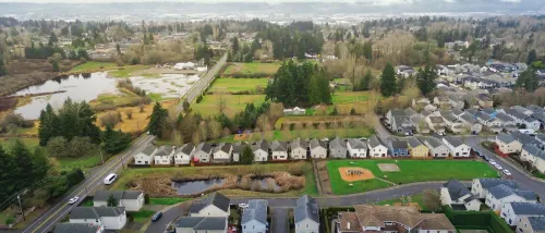 Aerial view of waterfront housing in East Hill to illustrate the best affordable neighborhoods in Kent, WA.