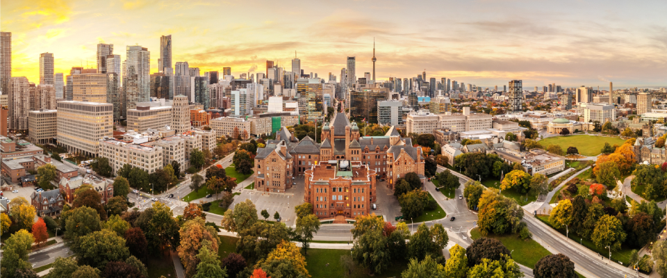 A golden hour drone photo of the skyline in Toronto, ON, one of the in-demand larger cities for renter interest in Canada.