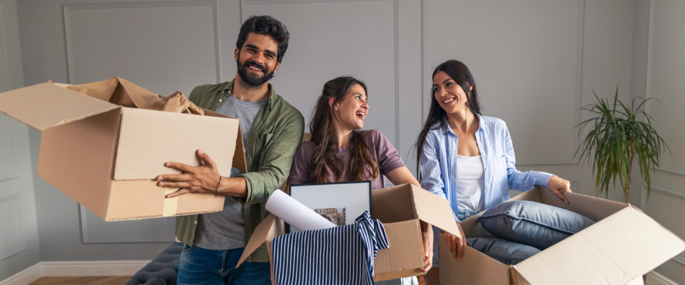 Friends becoming roommates after a successful college apartment search.