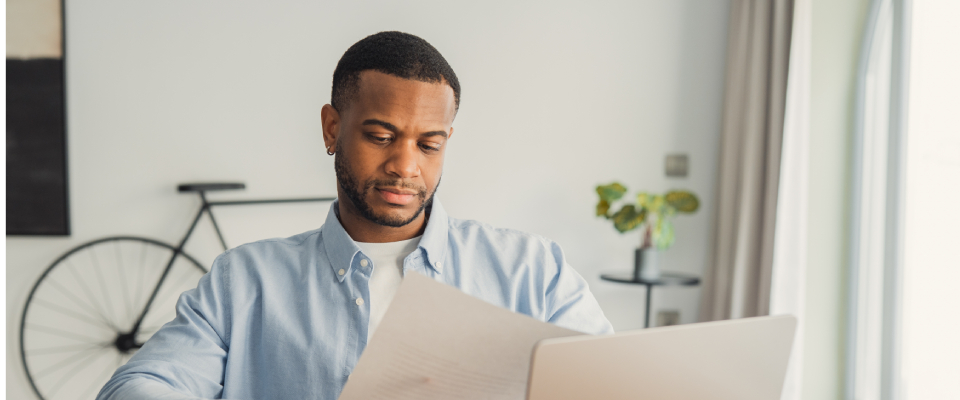 A concentrated person checking their credit and tenant screening reports.