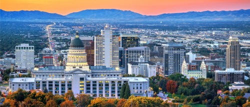 A dusk-time shot of the skyline in Salt Lake City, where renters have plenty of options in terms of public transit.