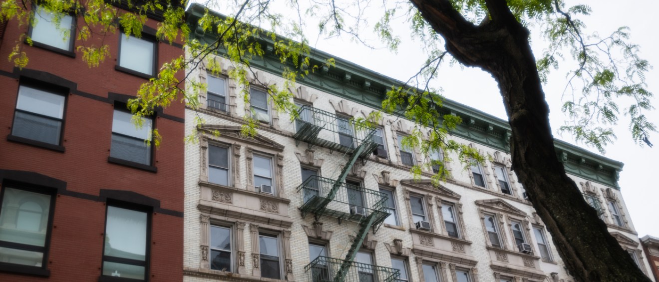 A photo of an apartment building where a renter could find an apartment if their rental history is good enough.