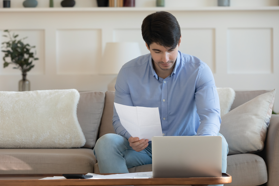 person checking the tenant screening report for lease application