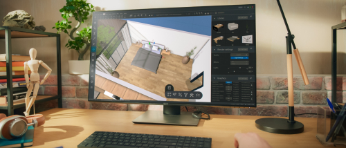 Person viewing a 3D apartment tour on a desktop computer, showing a bird's-eye view of a bedroom with hardwood floors and large windows.