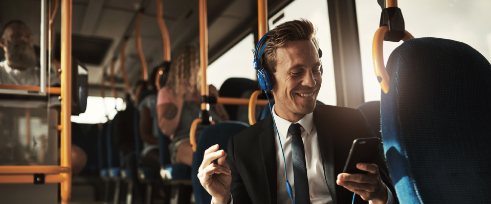 A person listening to music while using public transit.