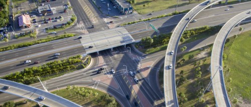 Apartments in McAllen highlighted by a bird’s-eye view of a South Texas roadway interchange, showcasing the city’s connectivity, infrastructure, and surrounding residential areas.