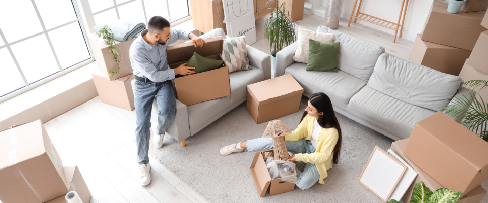 A couple moving in after finishing searching for apartments.