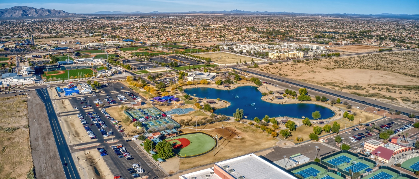 Apartments in Surprise highlighted by an aerial view of Surprise, Arizona, showcasing residential neighborhoods, parks, and the city's growing suburban landscape.