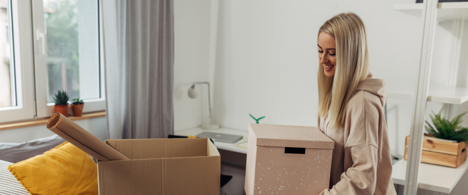 A college student moving from their dorm after finding their first apartment.