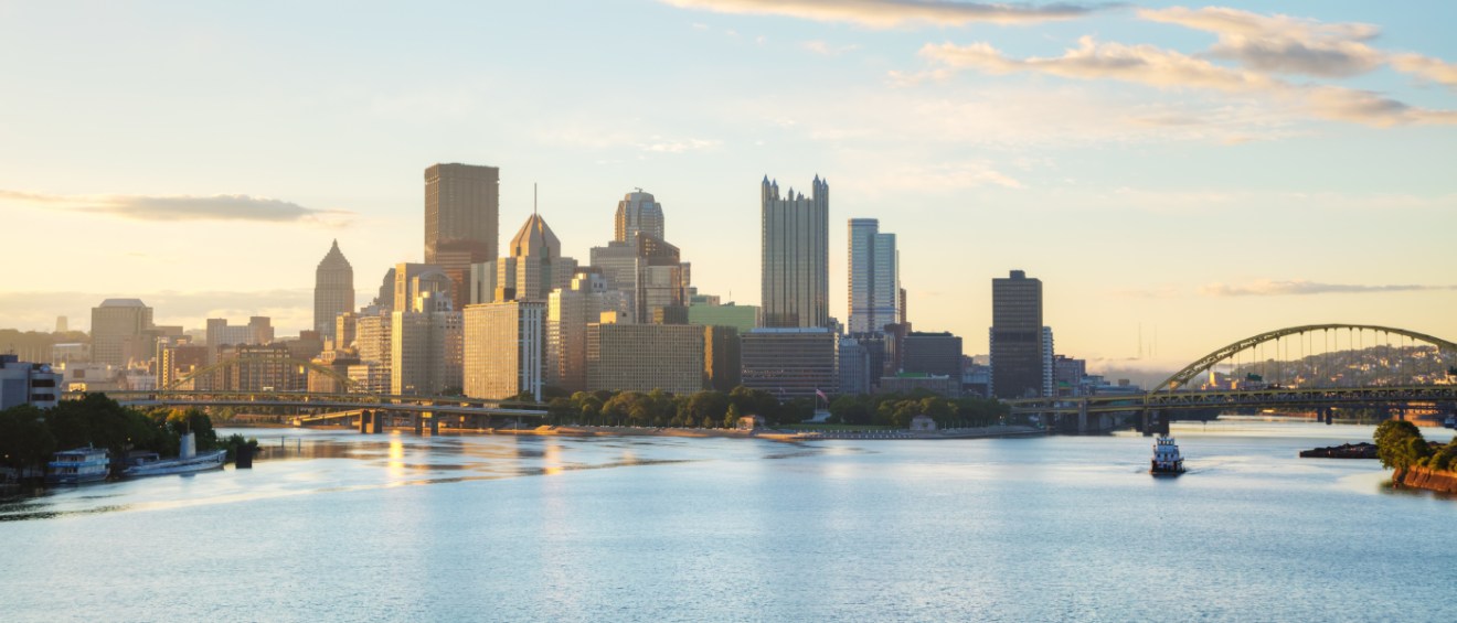A waterfront view of the skyline in Pittsburgh, a city where renters have plenty of public transit options to get around with.