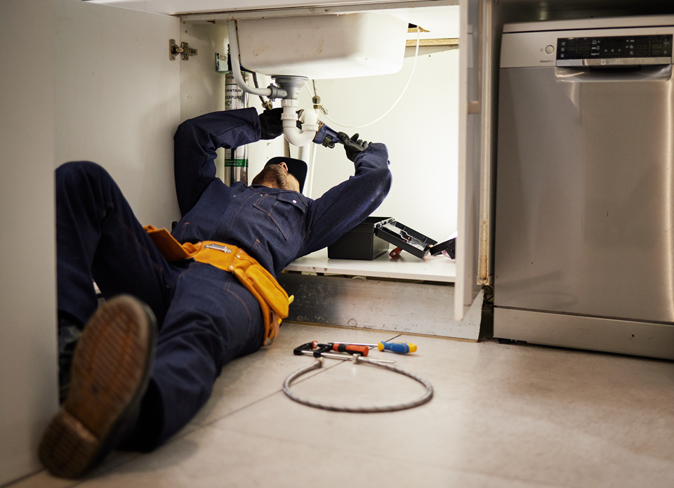 professional plumber fixing a maintenance issue