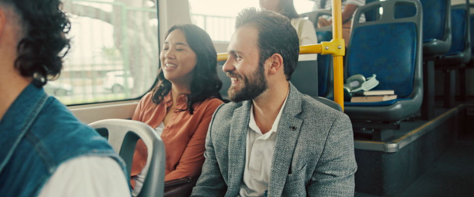 People talking while using public transit in Trenton, NJ.