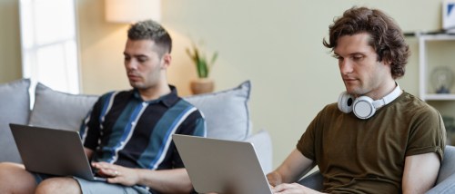 Two people working from home with roommates.