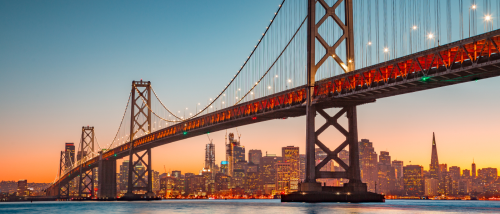 A photo of the Oakland Bay Bridge in San Francisco, a city where renters can find affordable neighborhoods with below average rents.