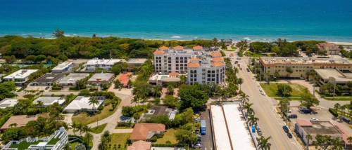 Boca Raton, FL, coastline with apartment buildings and a main road, highlighting public transit access for renters near the beach.