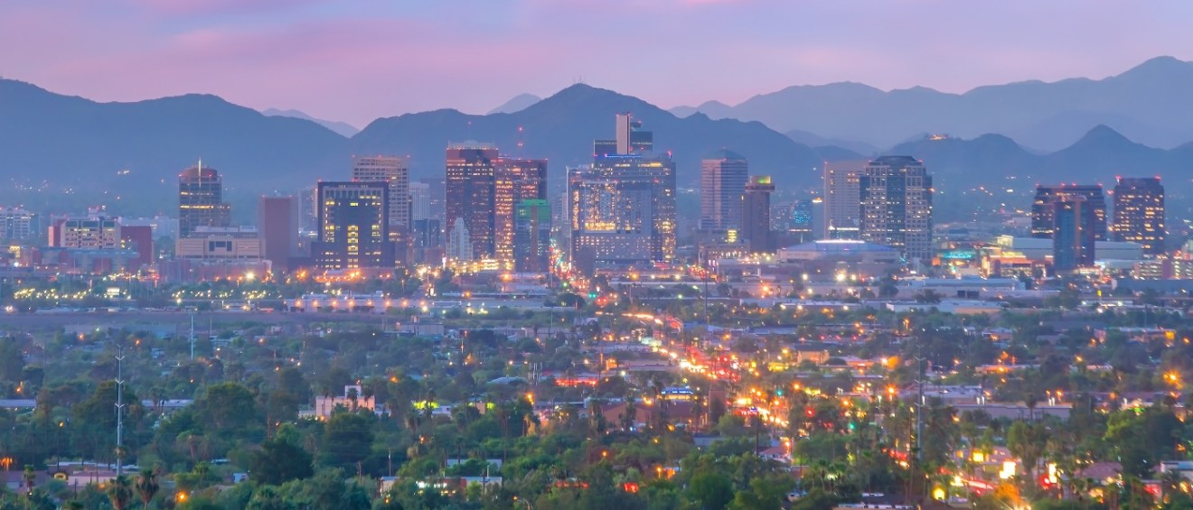 Phoenix, Arizona, downtown skyline at sunset, highlighting the cityscape and public transit options available to residents.