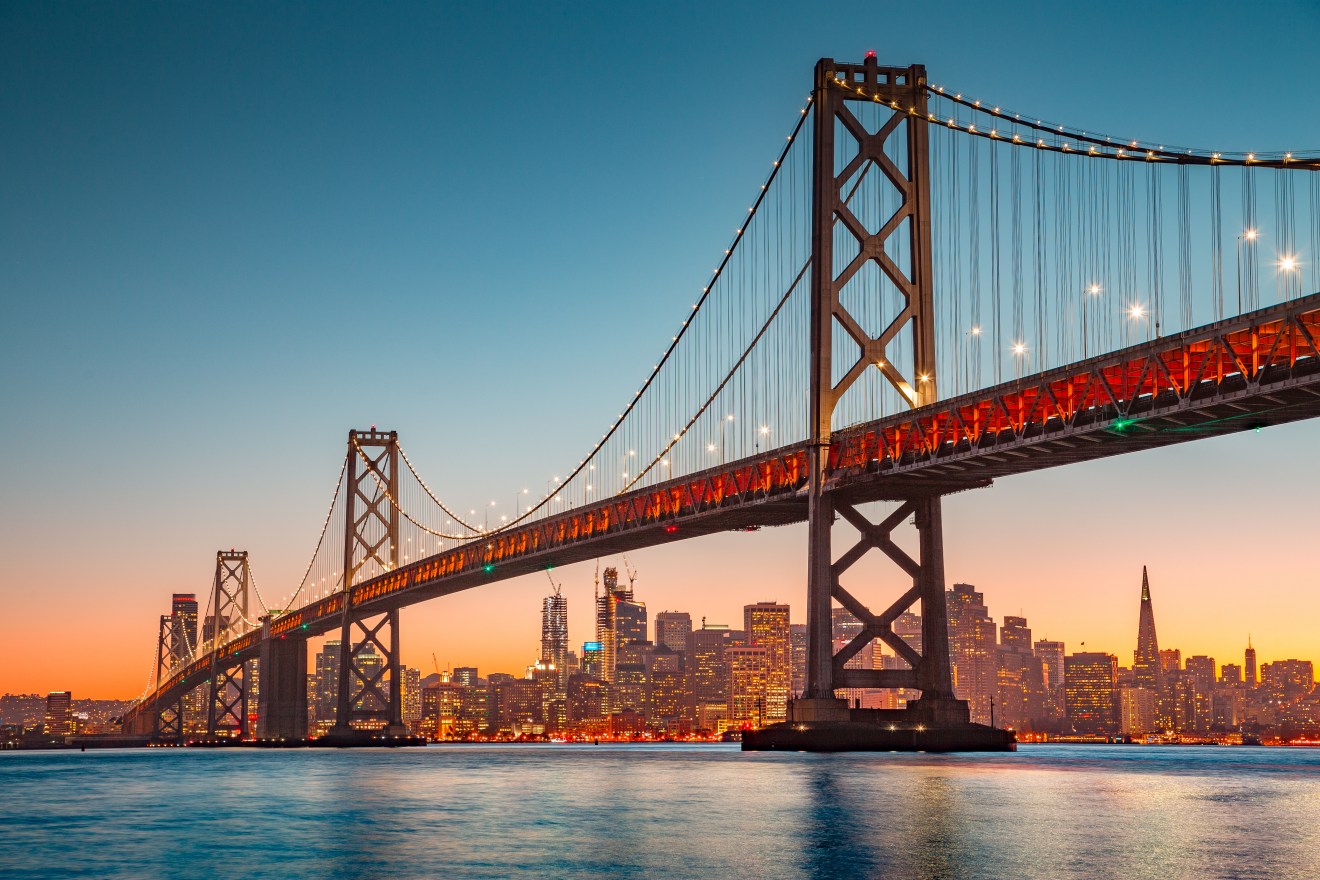 A photo of the Oakland Bay Bridge in San Francisco, a city where renters can find affordable neighborhoods with below average rents.