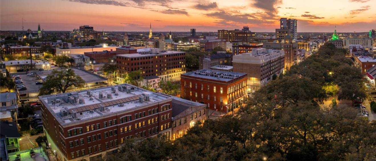 Savannah, Georgia historic American architecture of the old historic city in the United States of America with a southern cityscape at sunset showcasing one of the affordable neighborhoods.