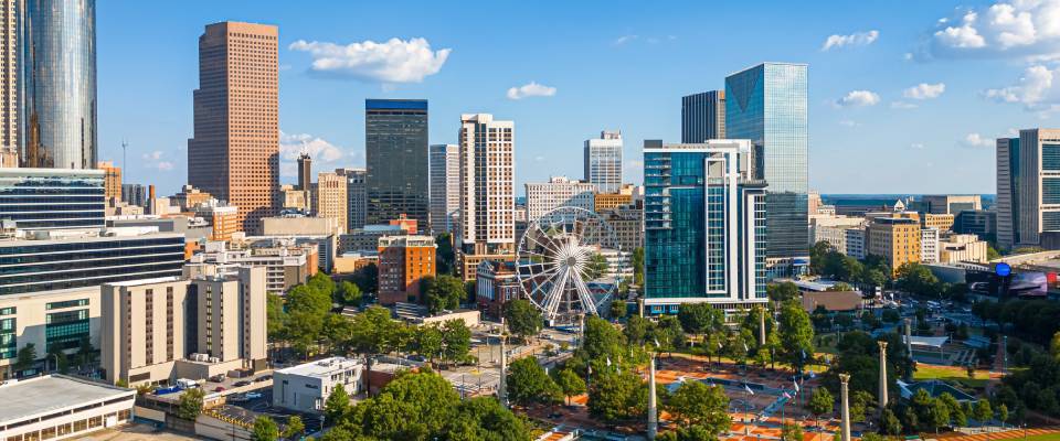 Vibrant aerial photograph of Atlanta, Georgia showcasing downtown skyscrapers, Centennial Olympic Park, and green urban spaces featured in the renter engagement tracker.