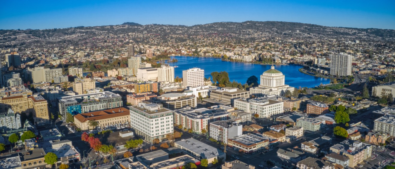 An aerial shot of downtown Oakland, CA, a city where renters have plenty of public transit options they can use to get around without a car.