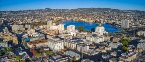 An aerial shot of downtown Oakland, CA, a city where renters have plenty of public transit options they can use to get around without a car.