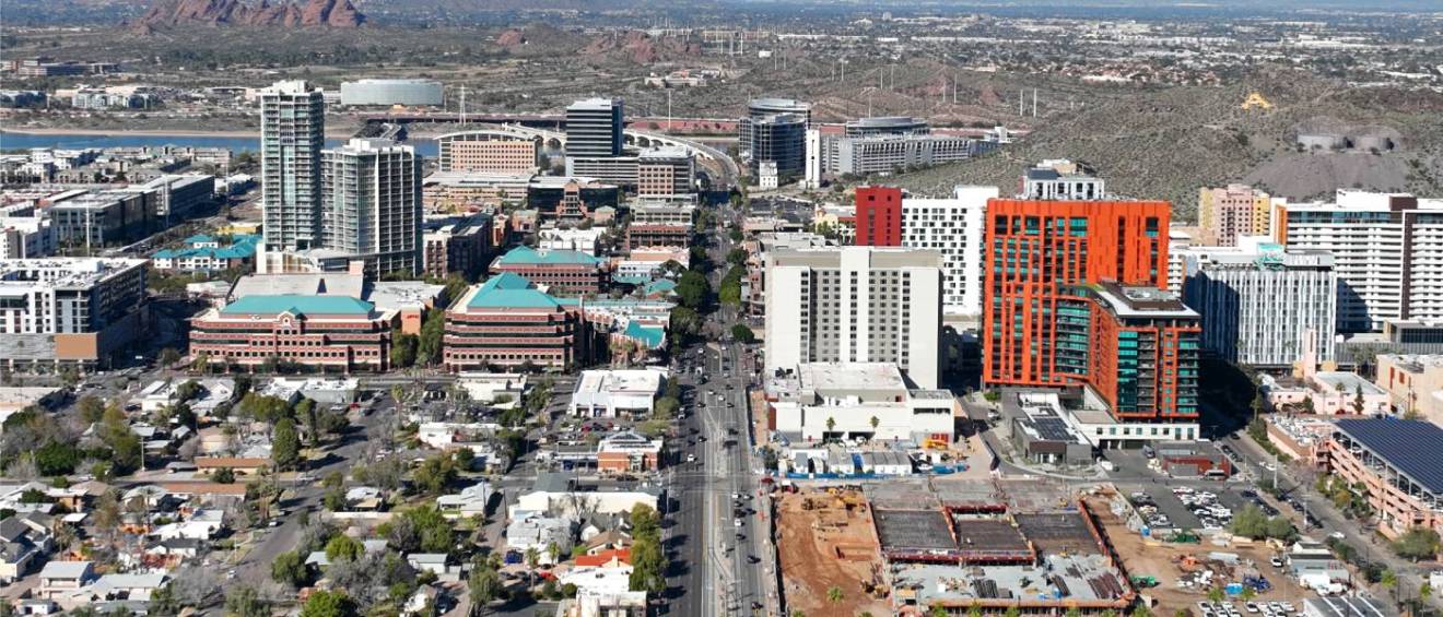 An aerial view of Tempe's modern city skyline along South Mill Avenue near Arizona State University, showcasing one of Arizona's affordable neighborhoods.