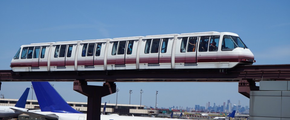 AirTrain monorail carrying passengers above the terminals at Newark Liberty International Airport, a key Newark public transit link.